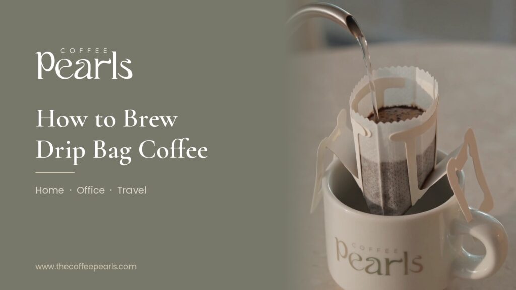 A Coffee Pearls drip bag hanging on a Pearls mug as hot water is poured from a gooseneck kettle